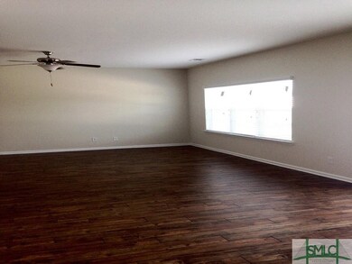 OPEN FAMILY ROOM WITH LAMINATE WOOD FLOORS