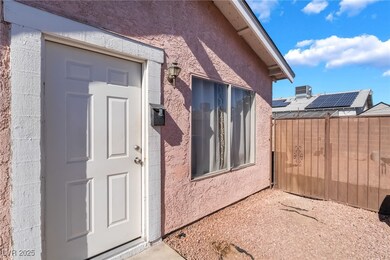 View of exterior entry with stucco siding