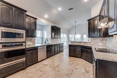 Kitchen featuring stainless steel appliances, loft