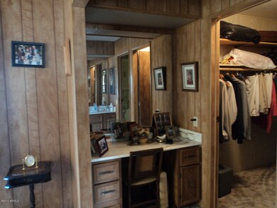 MASTER BEDROOM vanity and walk-in closet