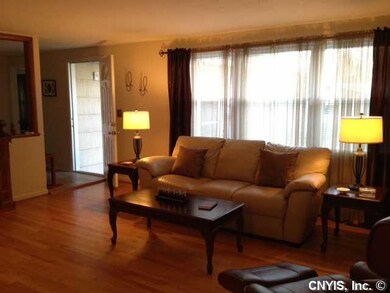 Living Room. Gleaming hardwood floors throughout t
