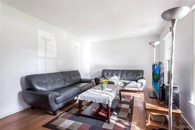 Freshly painted walls and ceiling in living room. Hardwood floors.