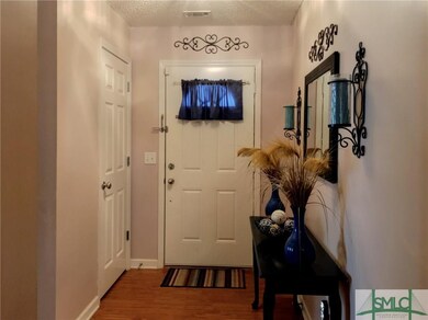 Inviting entryway with coat closet