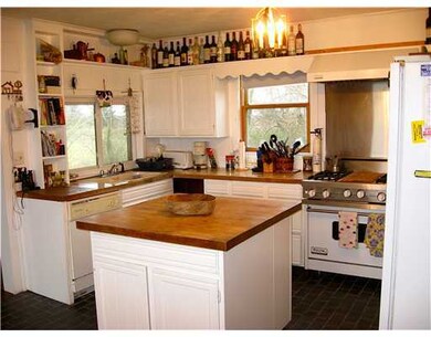 Kitchen. View of kitchen with center island and tr