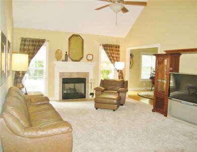 Great room with high vaulted ceiling and new carpe