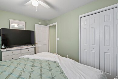 Bedroom with a closet and ceiling fan