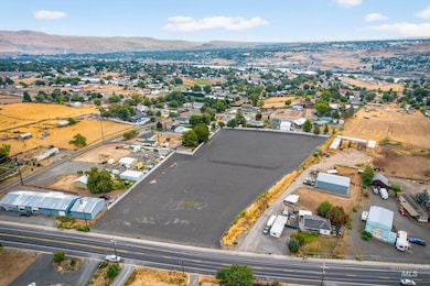 Aerial overview of property's location with a mountainous background