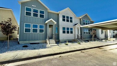 View of front of home with board and batten siding and entry steps