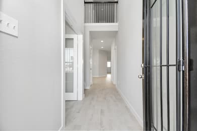 The majestic entryway allures with its high ceilin