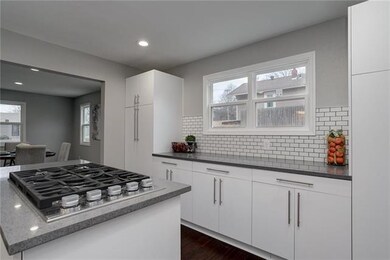 Gas Cooktop on Island with Large Built-In Server a