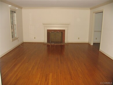 Living Room with wood burning fireplace that has n