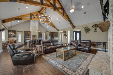 Open concept living/ kitchen area with grand vault
