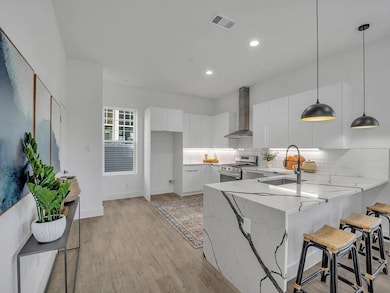 Kitchen featuring sink, stainless steel gas range 