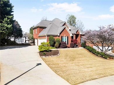View of front of house with an attached garage, br