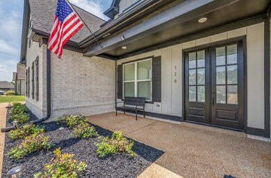 Entrance to property featuring a patio area and fr