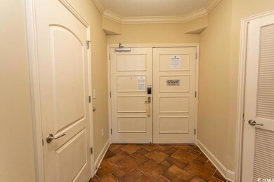 Doorway to outside with a textured ceiling and cro