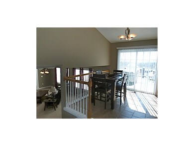 Eating area walks out to deck and overlooks lower 