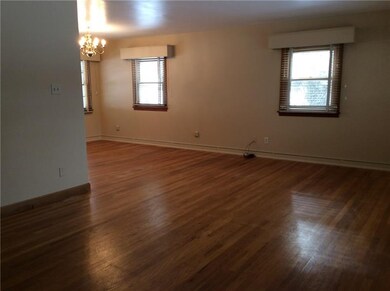 Freshly painted living room dining room - beautiful hard wood flooring - Light boxes over windows.