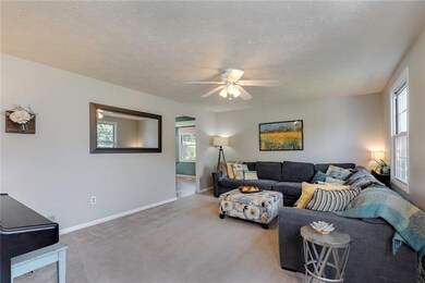 The light and bright living room welcomes you with