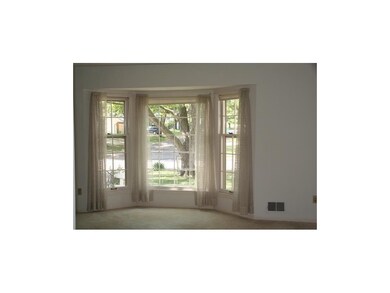 Three large windows bring in sunlight.