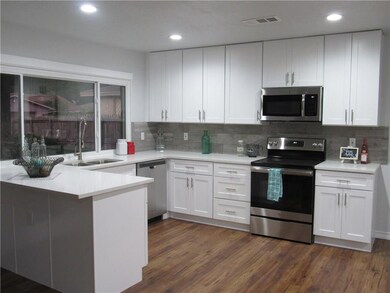 Quartz counter-tops with stainless steel appliance