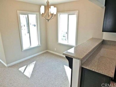Living & dining room opens to the custom remodeled