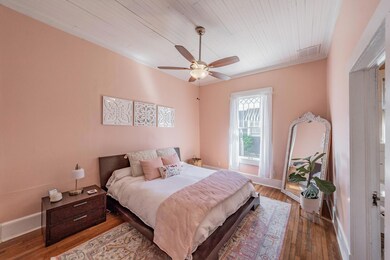 Bedroom featuring dark hardwood floors, beautiful 
