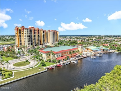 Living area featuring light tile patterned floors, recessed lighting, and stairway