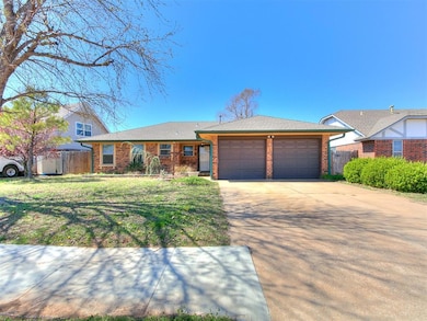 View of front facade with brick siding, driveway, 