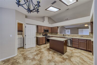 Kitchen with stainless steel appliances, a sink, v