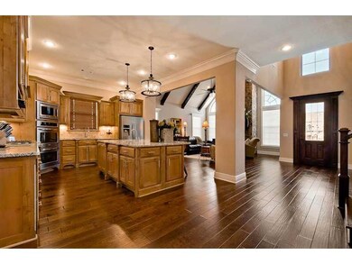 Kitchen. Features upgraded light fixtures, 5 burner gas counter top, double ovens, and a large pantry
