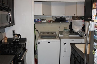 Washroom featuring washing machine and dryer