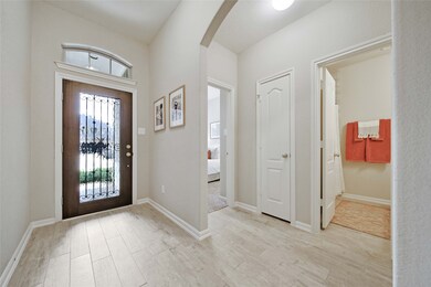 Light and bright wrought iron front door entry!