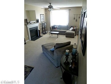 Living Room. Open floor plan- limitless possibilities. Fireplace centrally located to be enjoyed by all areas of the first level, including breakfast/kitchen space.