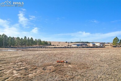 View of yard with a rural view and fence