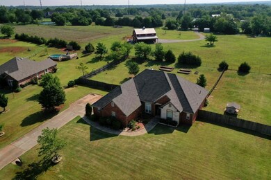 Large acreage behind home offers extra privacy.
