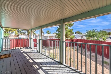 Wooden terrace with a fenced backyard