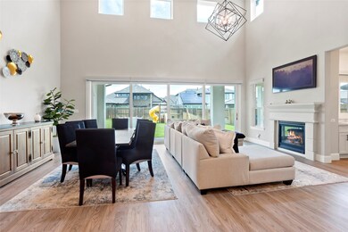 This spacious living area features high ceilings,