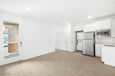Kitchen with estacked washer and dryer, freestandi