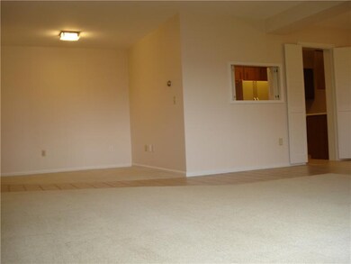Den. Off to the side of the main living space is a
