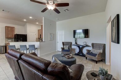 Living area with light tile patterned flooring, c