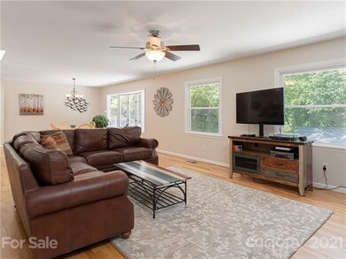 Living room flows from dining area and kitchen