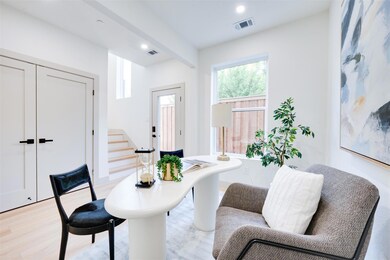 Living area with beamed ceiling and light wood-typ