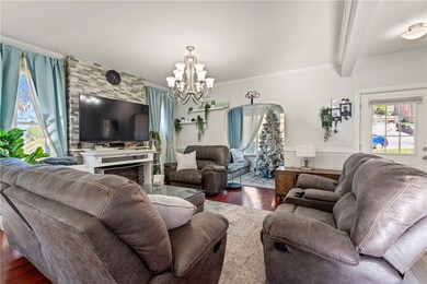 Open concept living room front door and sun room,