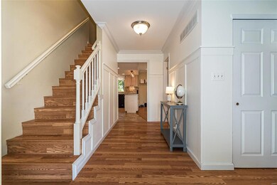 The Main Entry corridor features a timeless wainsc