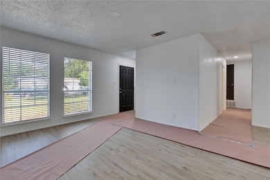 Unfurnished room featuring wood finished floors, 
