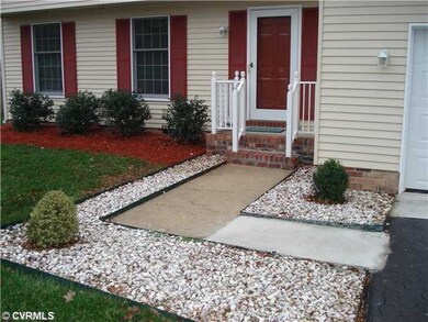Exterior Front - Beaitiful landscaping is inviting