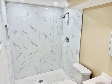 Bathroom featuring vanity and a stall shower