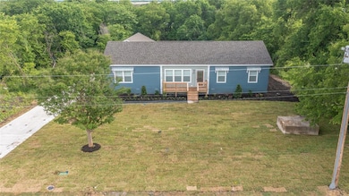 Mature trees and St. Augustine turf with irrigation system