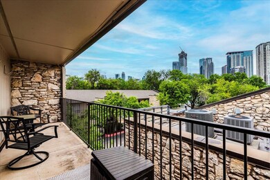 Balcony with cooling unit and a city view